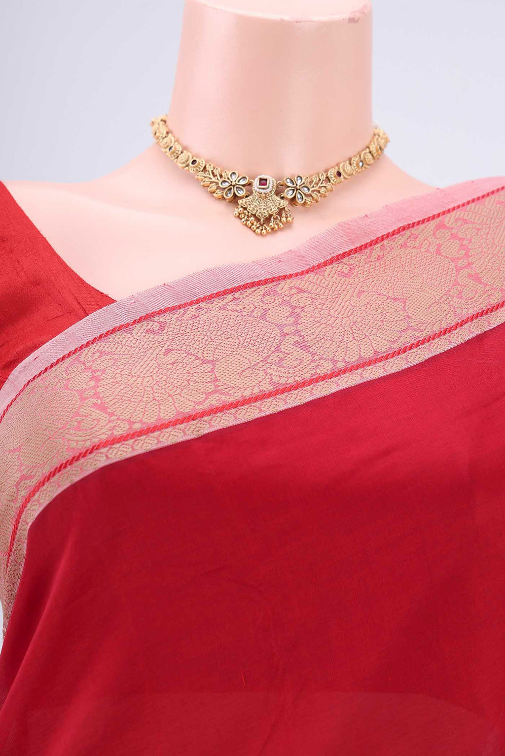 Border image of Red Blended Poly Cotton Saree with Plain Body and Thread Border. 