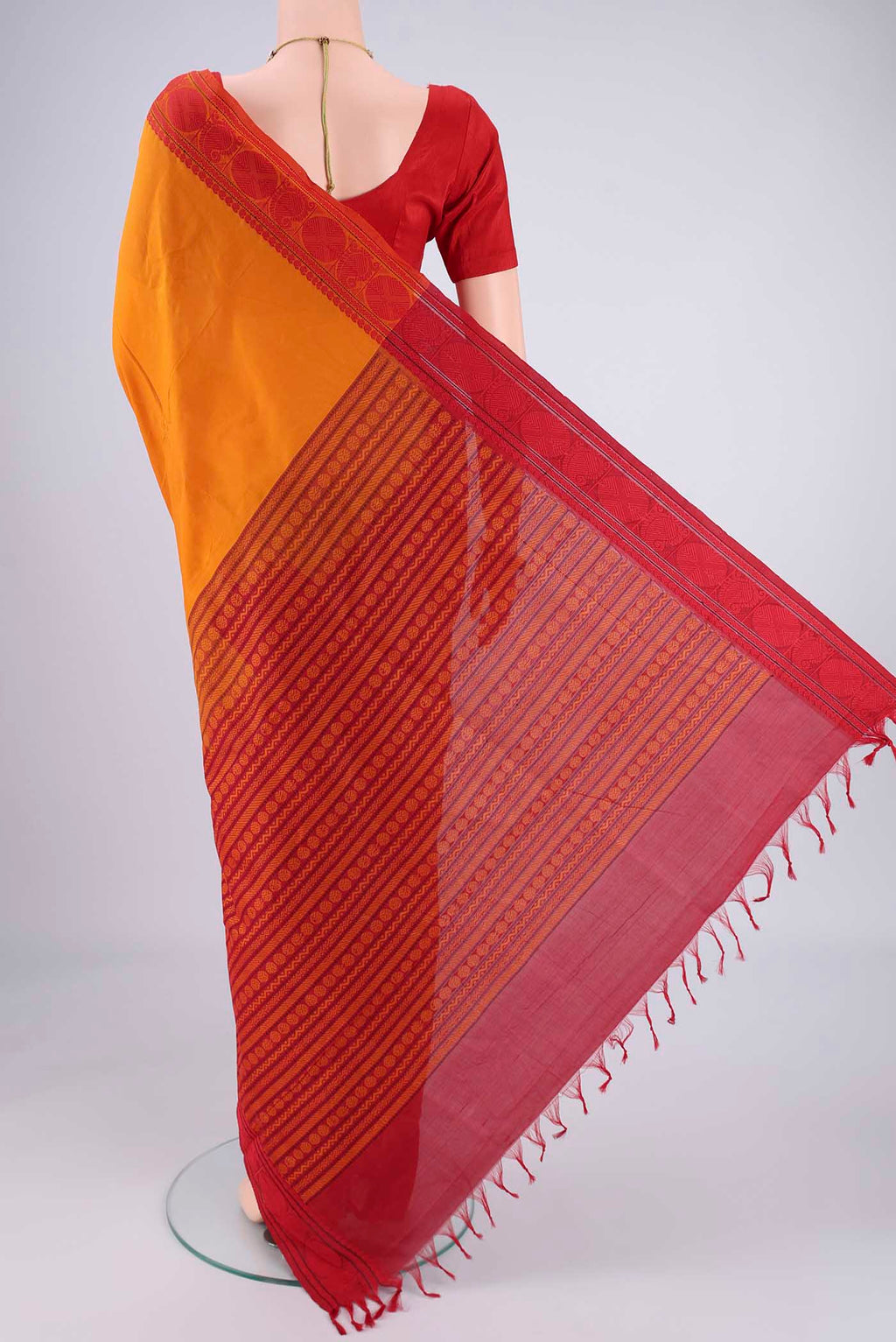 Flat view of Yellow Blended Poly Cotton Saree with Plain Body and Thread Border. 