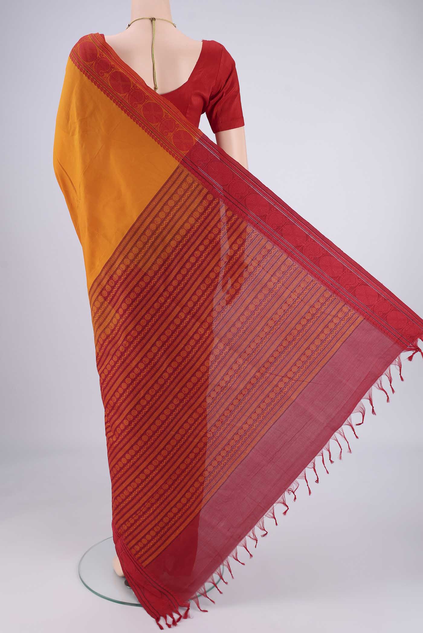 Flat view of Yellow Blended Poly Cotton Saree with Plain Body and Thread Border. 