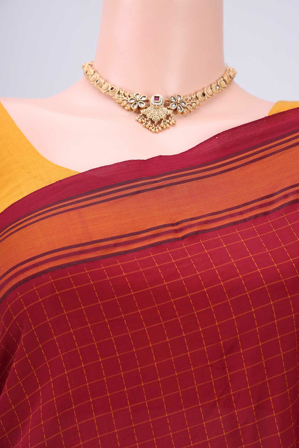 Border image of Maroon Blended Poly Cotton Saree with Checked design on the body and Thread Border. 