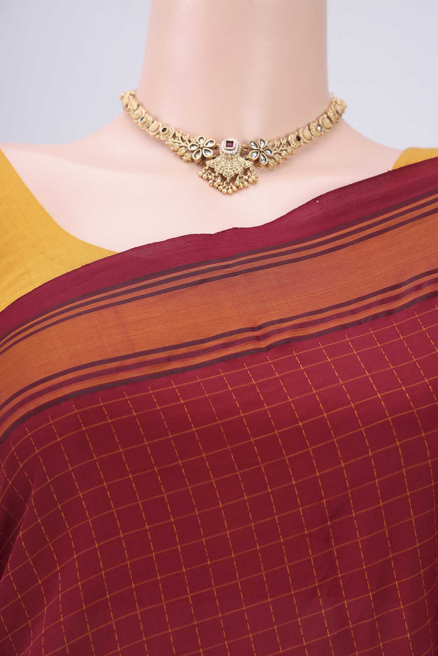 Border image of Maroon Blended Poly Cotton Saree with Checked design on the body and Thread Border. 