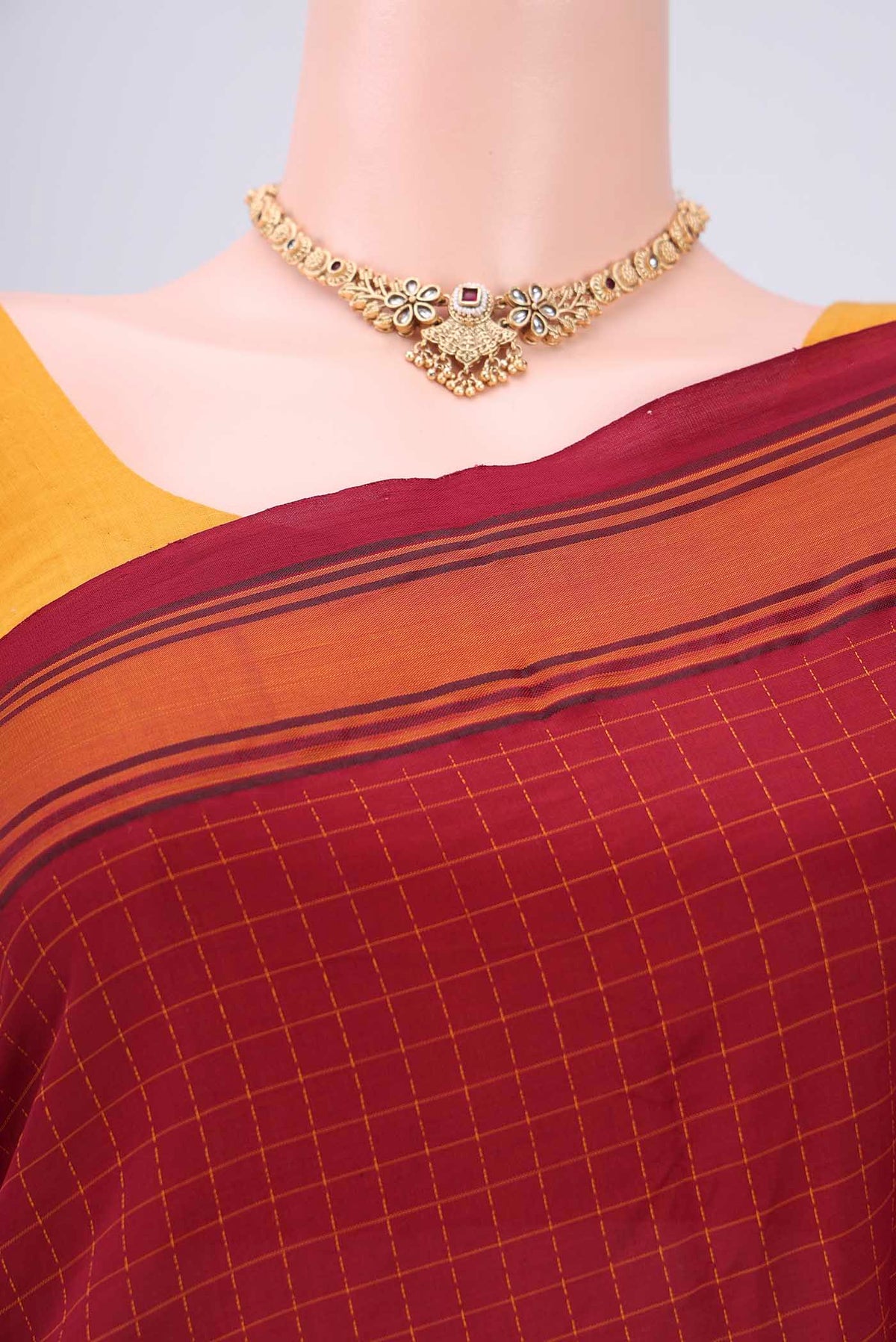 Border image of Maroon Blended Poly Cotton Saree with Checked design on the body and Thread Border. 