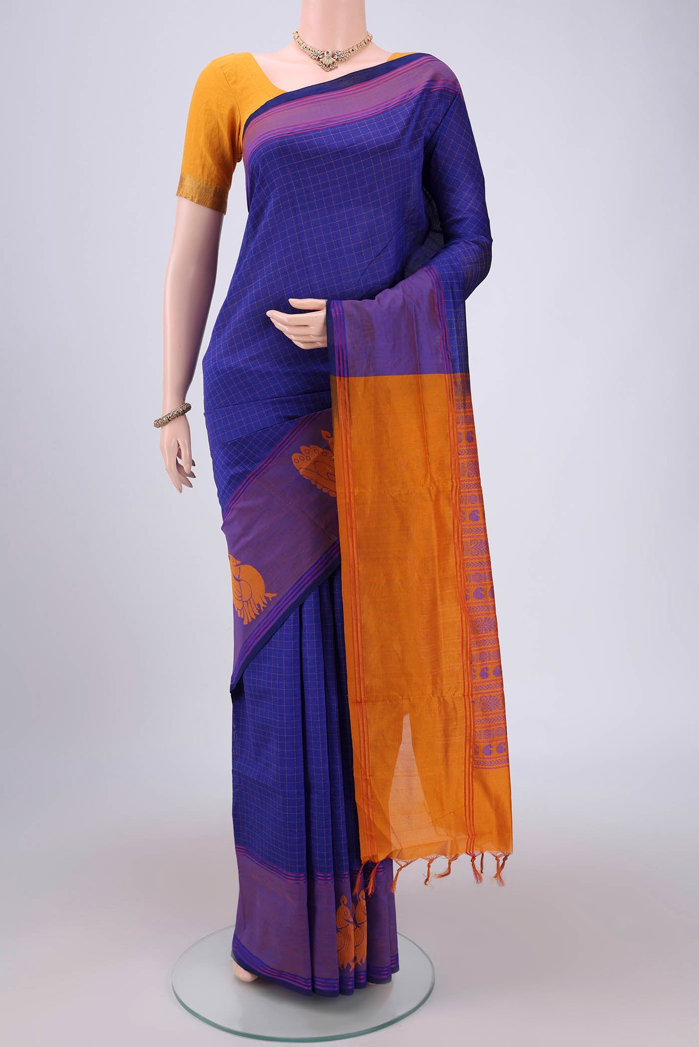 Royal Blue Blended Poly Cotton Saree with Checked design on the body and Thread Border.  displayed on a mannequin