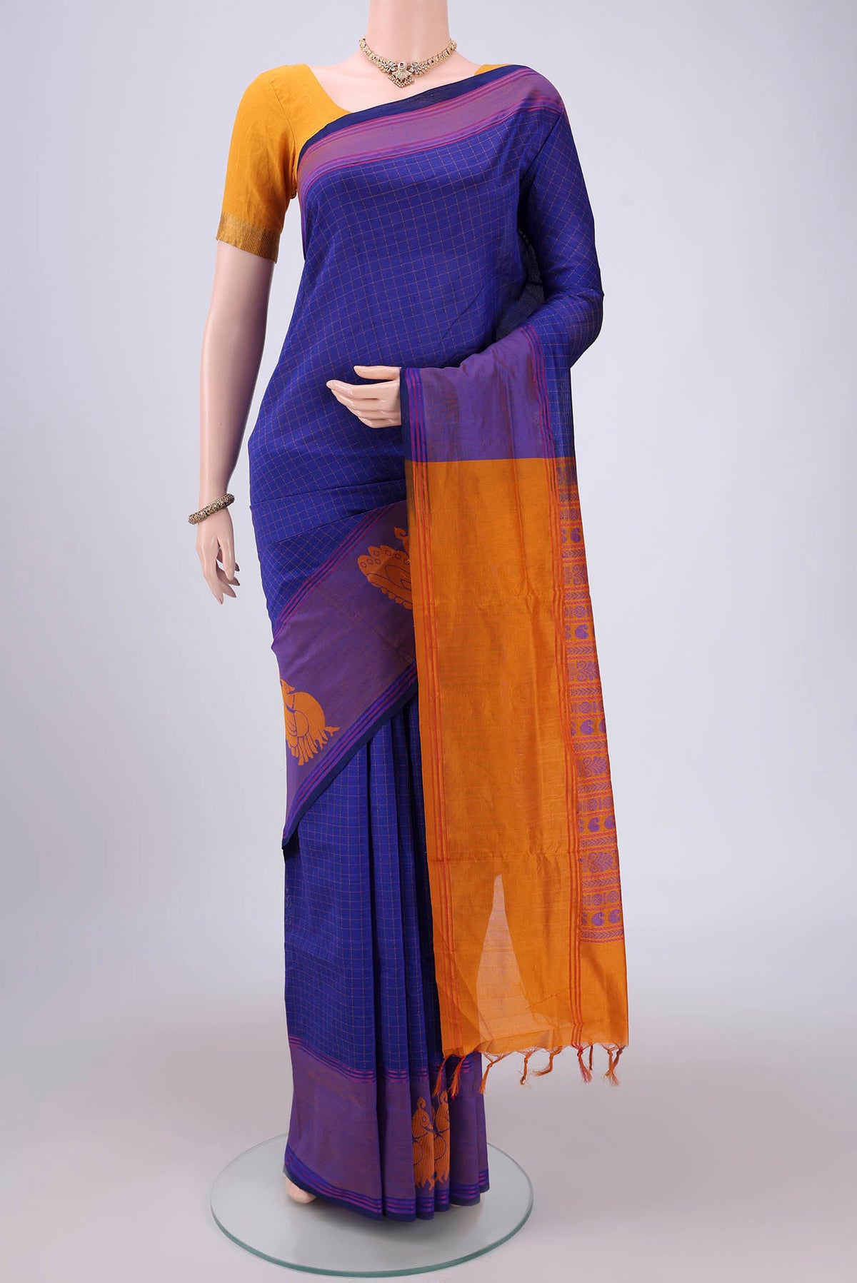 Royal Blue Blended Poly Cotton Saree with Checked design on the body and Thread Border.  displayed on a mannequin