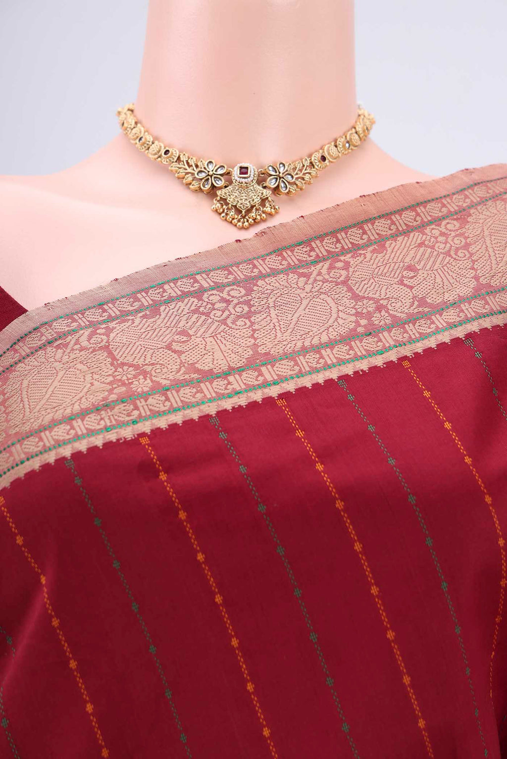 Border image of Maroon Blended Poly Cotton Saree with Stripes on the body and Thread Border. 