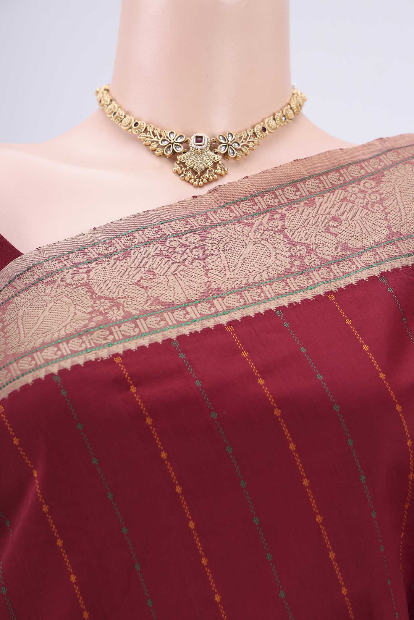 Border image of Maroon Blended Poly Cotton Saree with Stripes on the body and Thread Border. 
