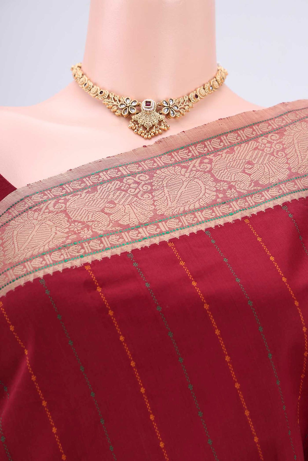 Border image of Maroon Blended Poly Cotton Saree with Stripes on the body and Thread Border. 