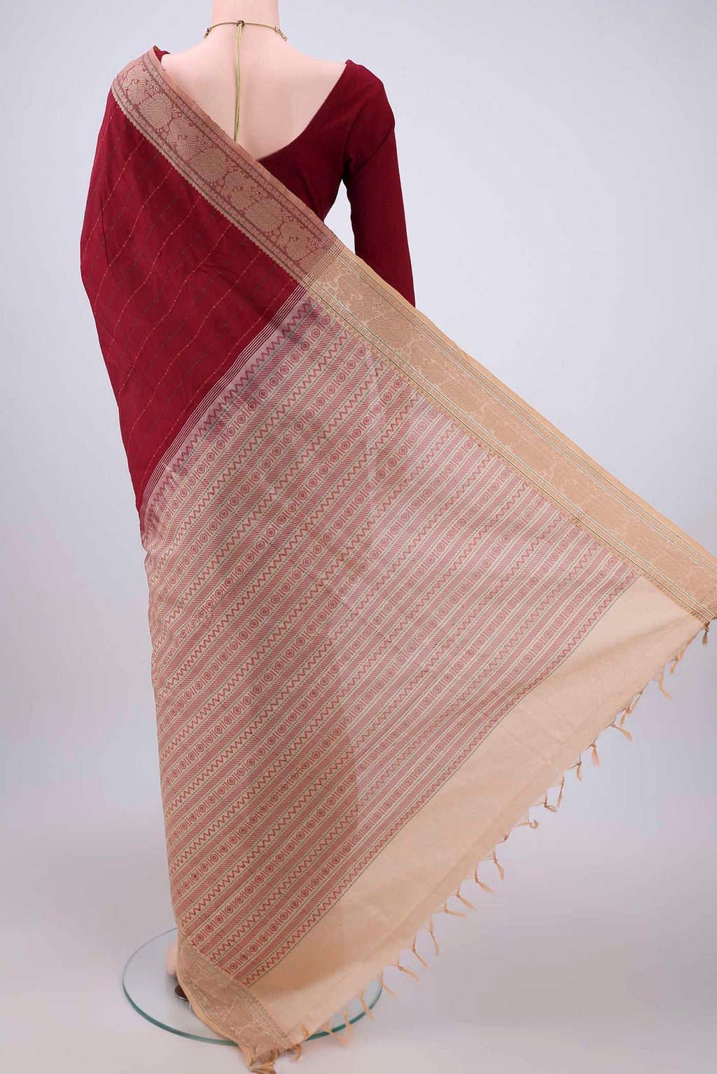 Flat view of Maroon Blended Poly Cotton Saree with Stripes on the body and Thread Border. 