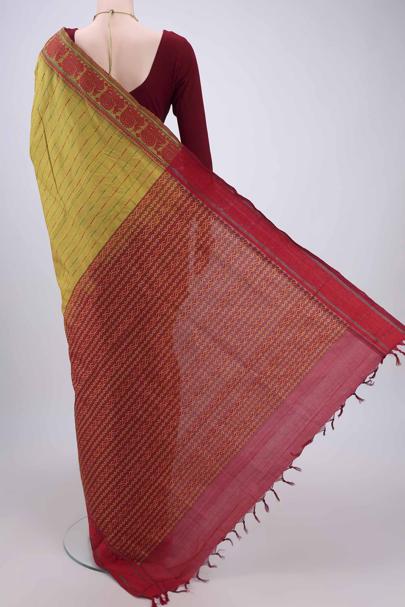 Flat view of Acid Green Blended Poly Cotton Saree with Stripes on the body and Thread Border. 