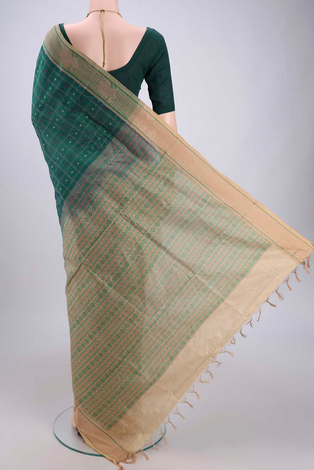 Flat view of Green Blended Poly Cotton Saree with Checked design on the body and Thread Border. 