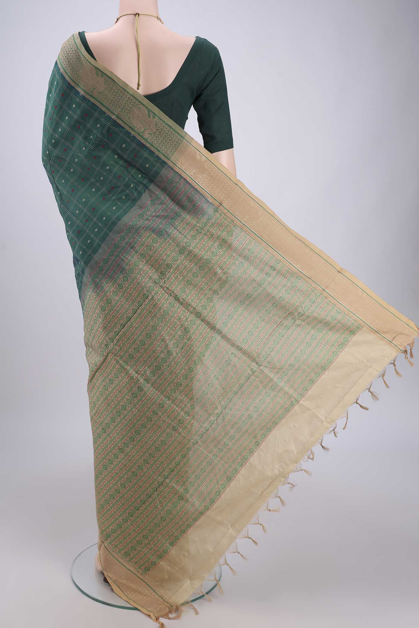 Flat view of Green Blended Poly Cotton Saree with Checked design on the body and Thread Border. 