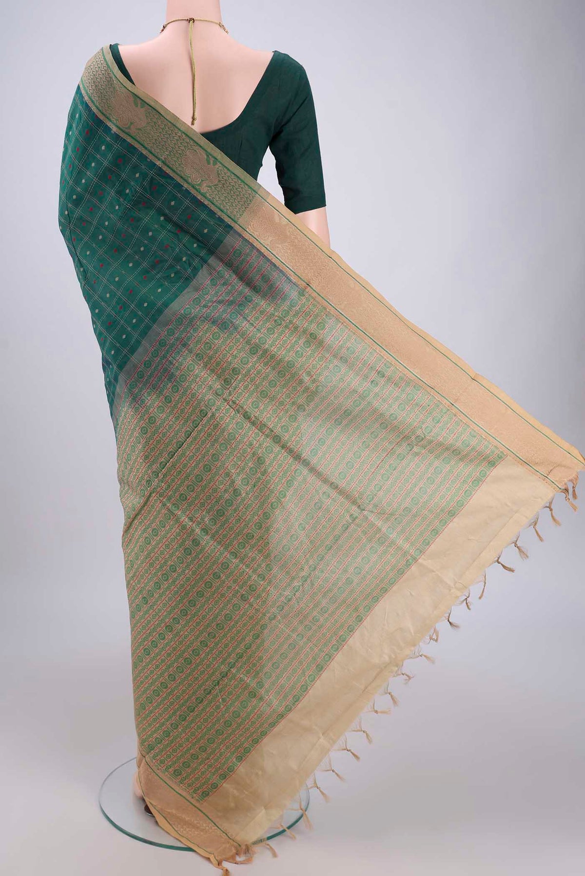 Flat view of Green Blended Poly Cotton Saree with Checked design on the body and Thread Border. 