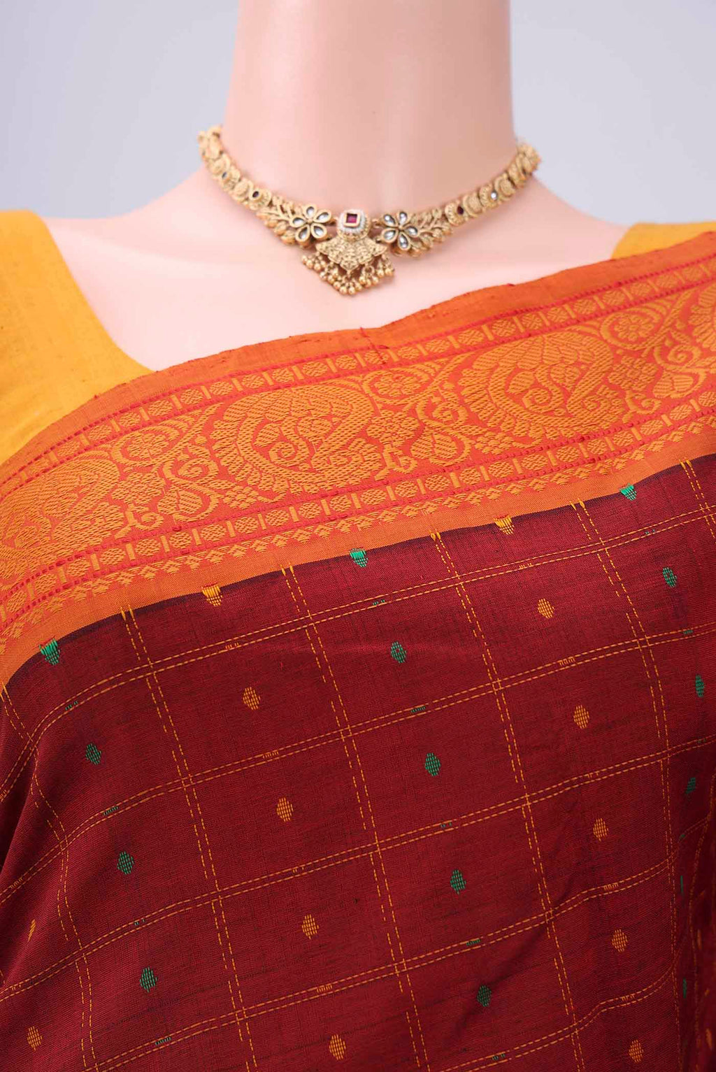 Border image of Maroon Blended Poly Cotton Saree with Checked design on the body and Thread Border. 