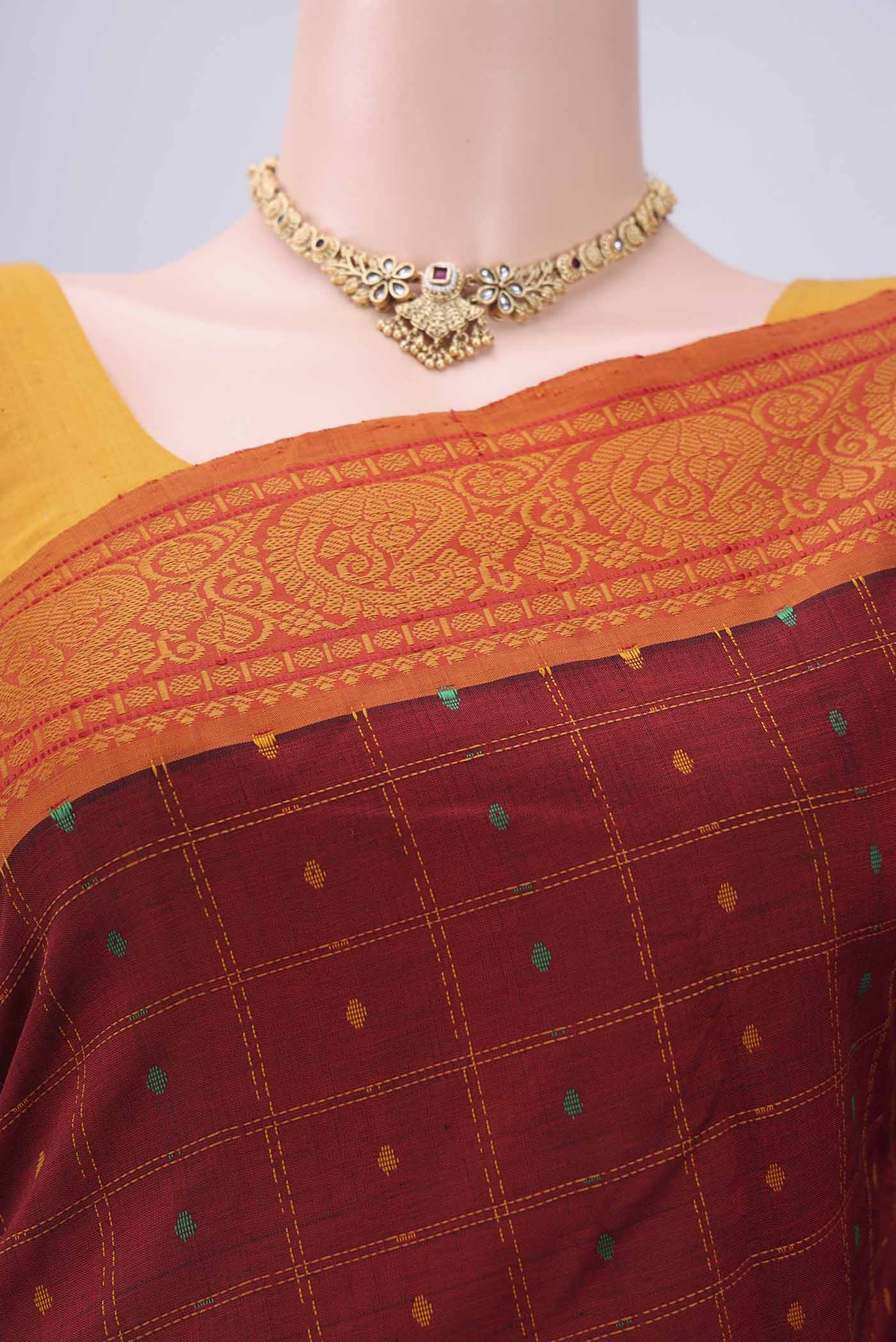 Border image of Maroon Blended Poly Cotton Saree with Checked design on the body and Thread Border. 