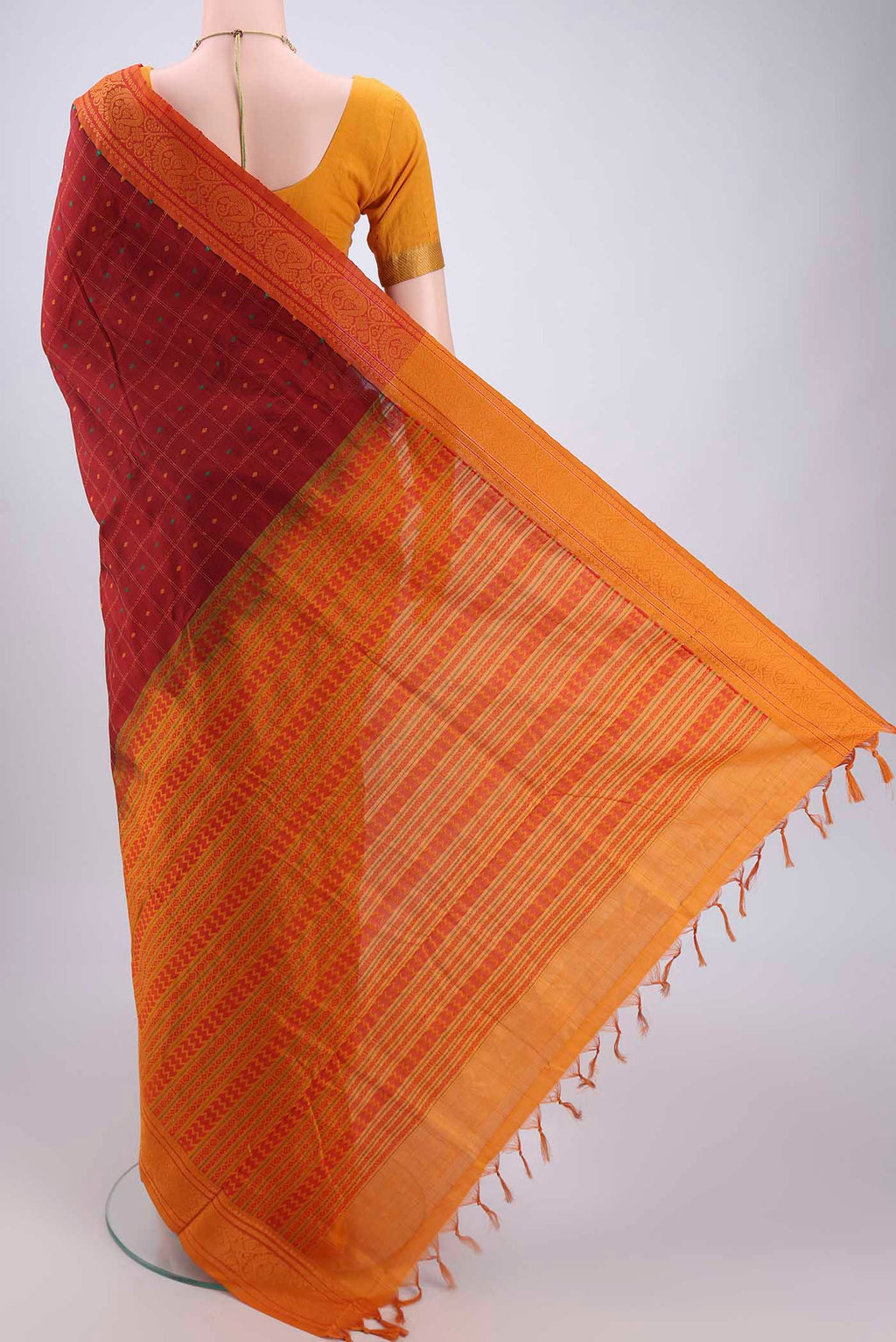 Flat view of Maroon Blended Poly Cotton Saree with Checked design on the body and Thread Border. 