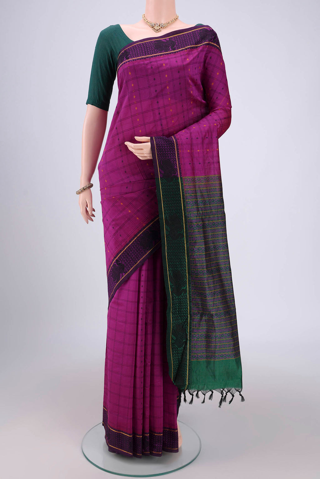 Magenta Blended Poly Cotton Saree with Checked design on the body and Thread Border.  displayed on a mannequin