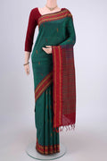 Bottle Green Blended Poly Cotton Saree with Thread Butta on the body and Thread Border.  displayed on a mannequin