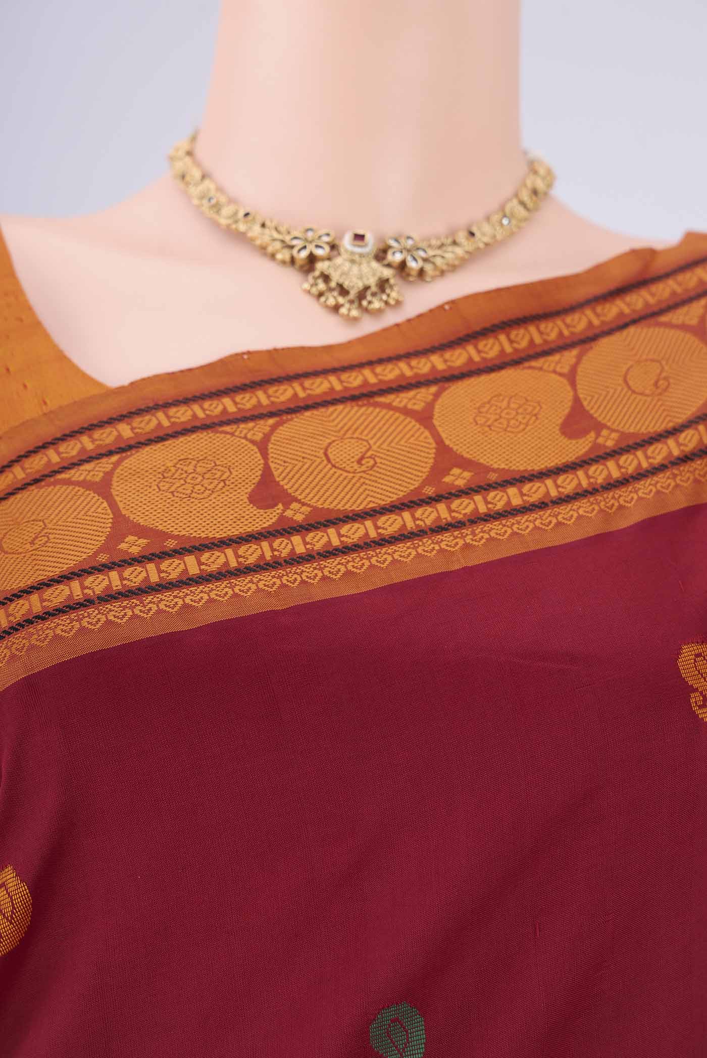 Border image of Maroon Blended Poly Cotton Saree with Thread Butta on the body and Thread Border. 