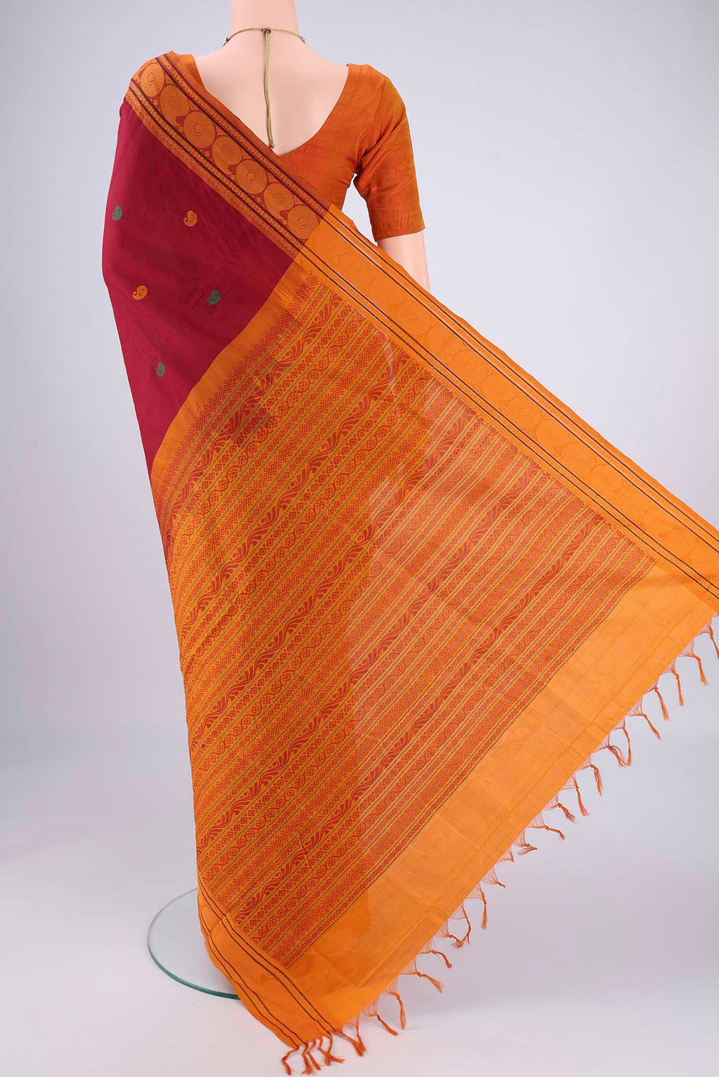 Flat view of Maroon Blended Poly Cotton Saree with Thread Butta on the body and Thread Border. 