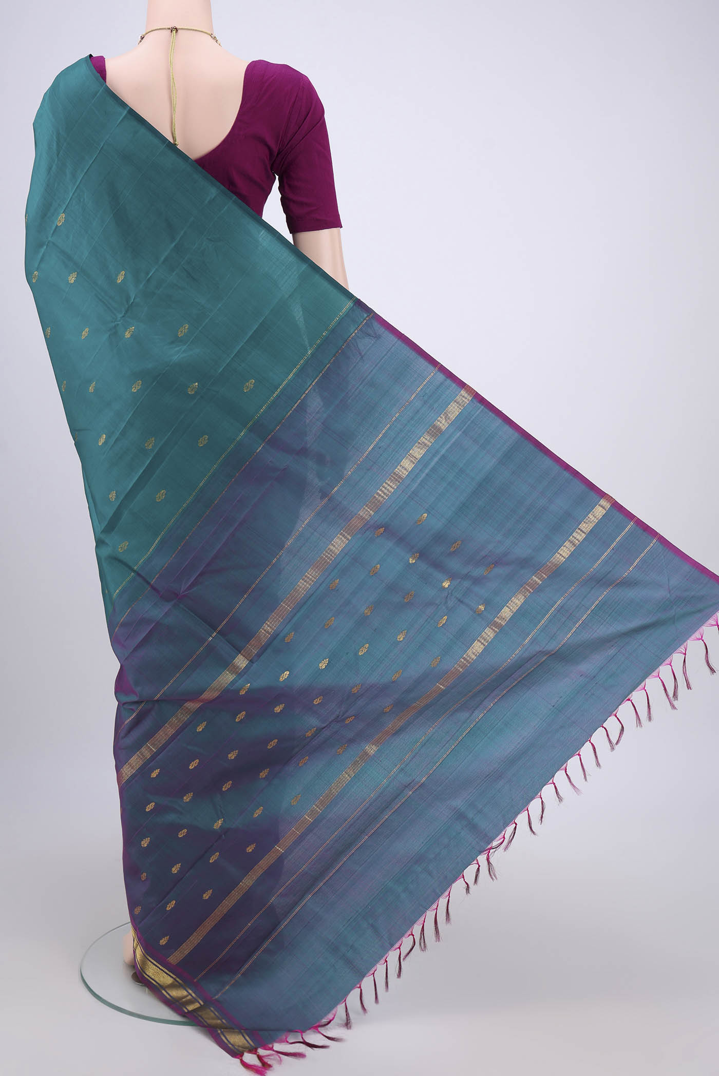 Flat view of Peacock Blue Kanchipuram Silk Saree with Zari Butta on the body and One Side Border. 
