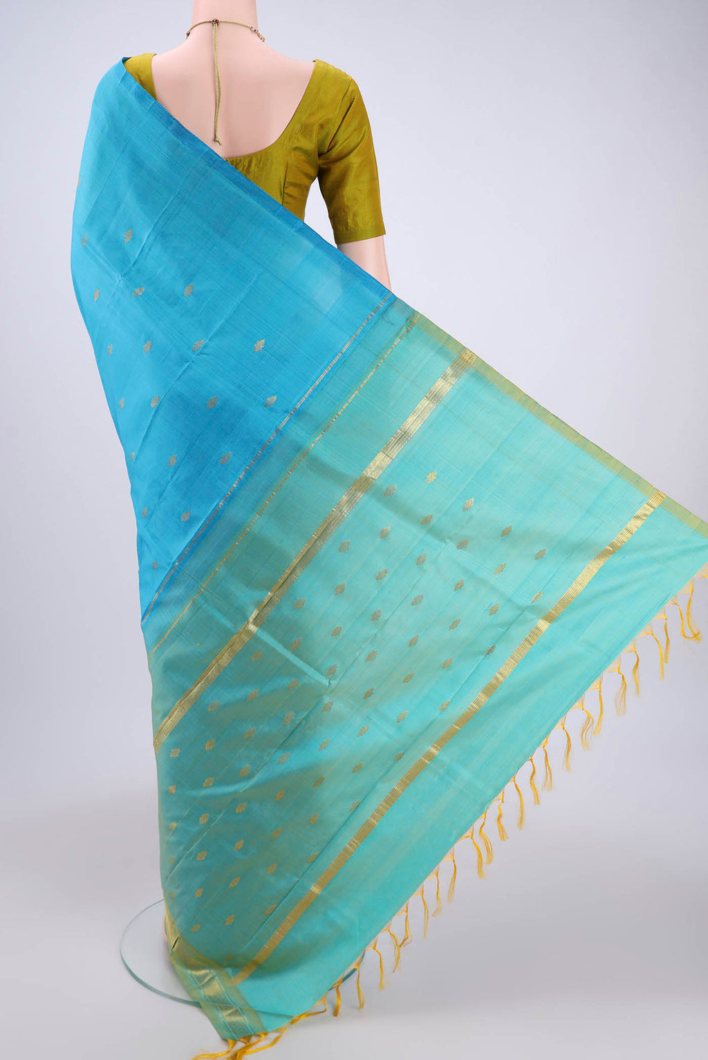 Flat view of Blue Kanchipuram Silk Saree with Zari Butta on the body and One Side Border. 
