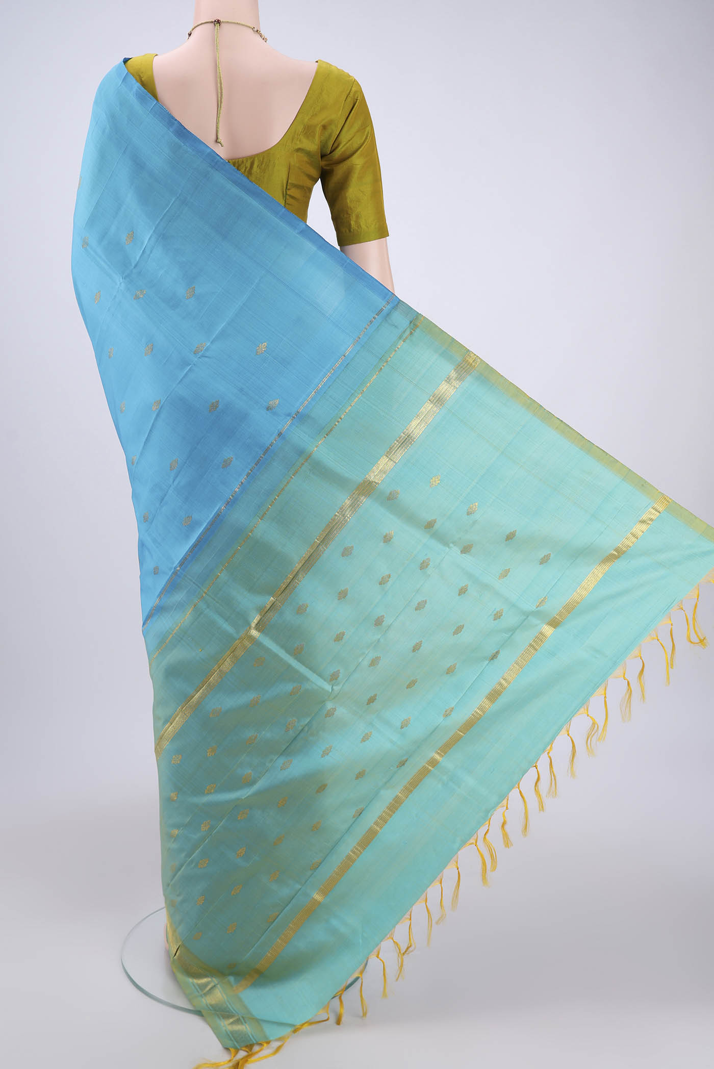 Flat view of Blue Kanchipuram Silk Saree with Zari Butta on the body and One Side Border. 