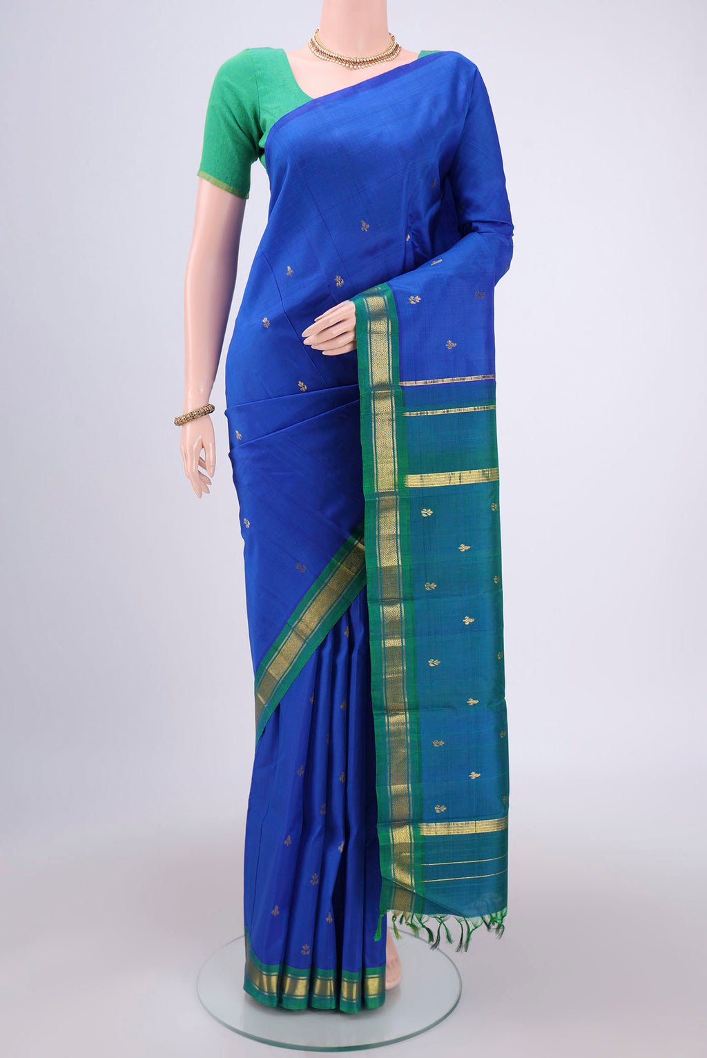 Royal Blue Dual Tone Kanchipuram Silk Saree with Zari Butta on the body and One Side Border.  displayed on a mannequin
