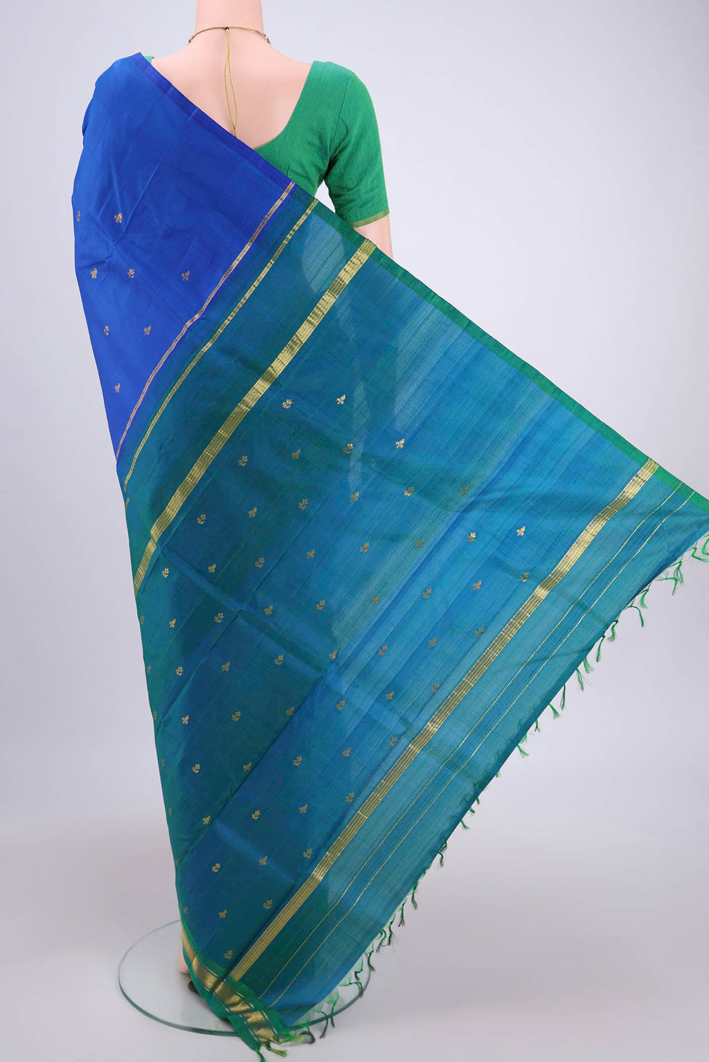 Flat view of Royal Blue Dual Tone Kanchipuram Silk Saree with Zari Butta on the body and One Side Border. 