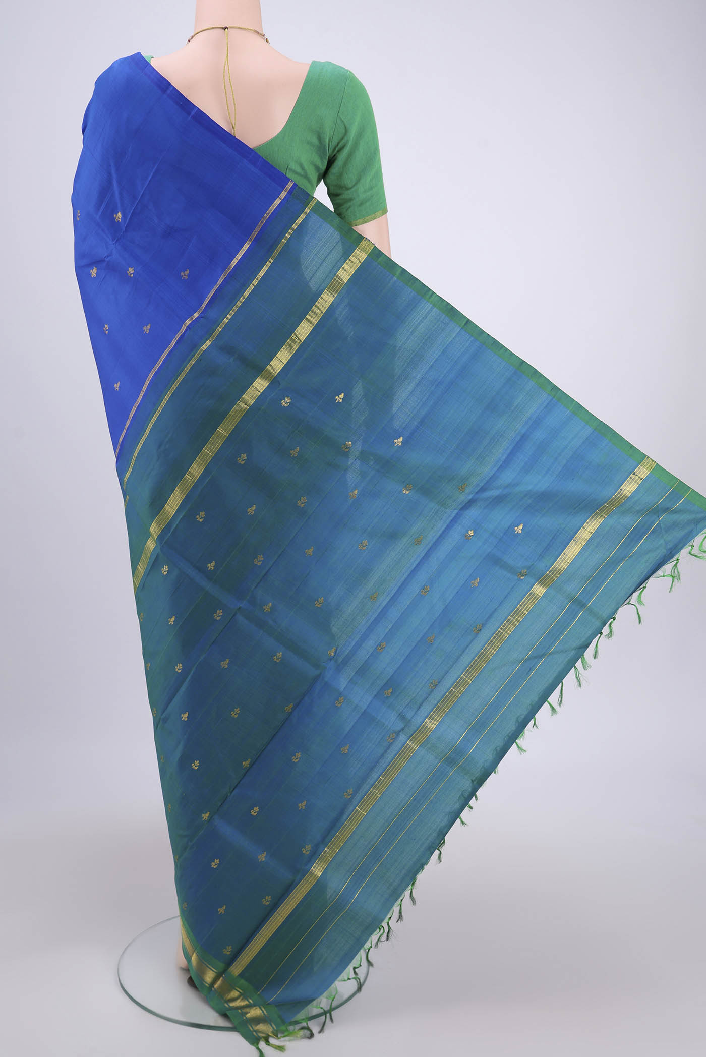 Flat view of Royal Blue Dual Tone Kanchipuram Silk Saree with Zari Butta on the body and One Side Border. 