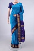 Pure Silk Blue Kanjivaram Saree with Zari Butta on the body and Zari Border.  displayed on a mannequin