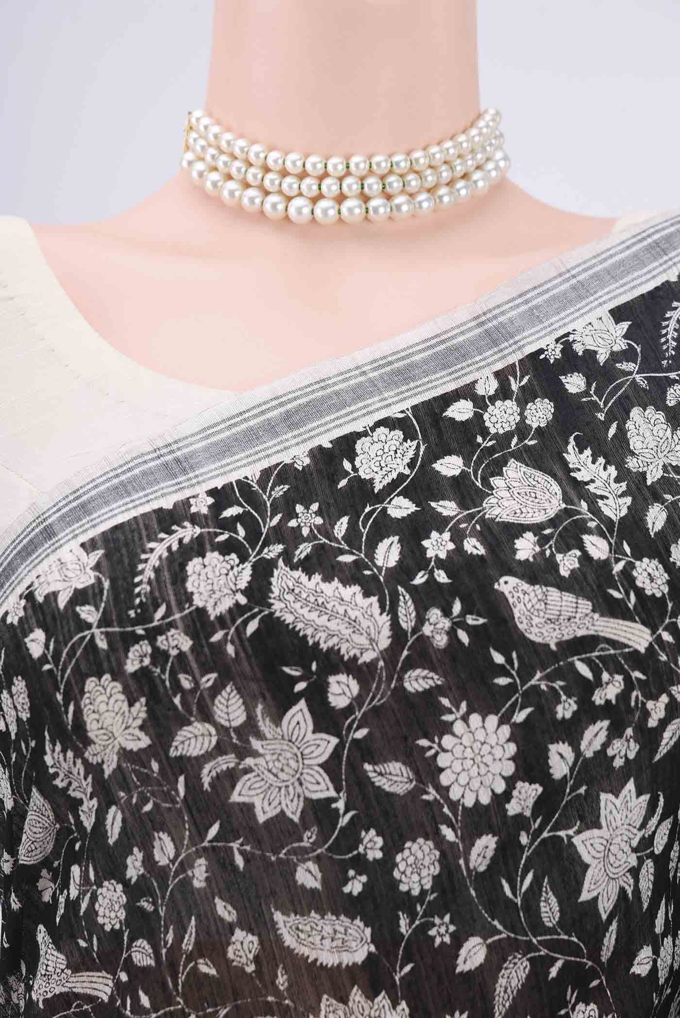 Border image of Black Tussar Silk Saree with Printed design on the body and Plain Border. 