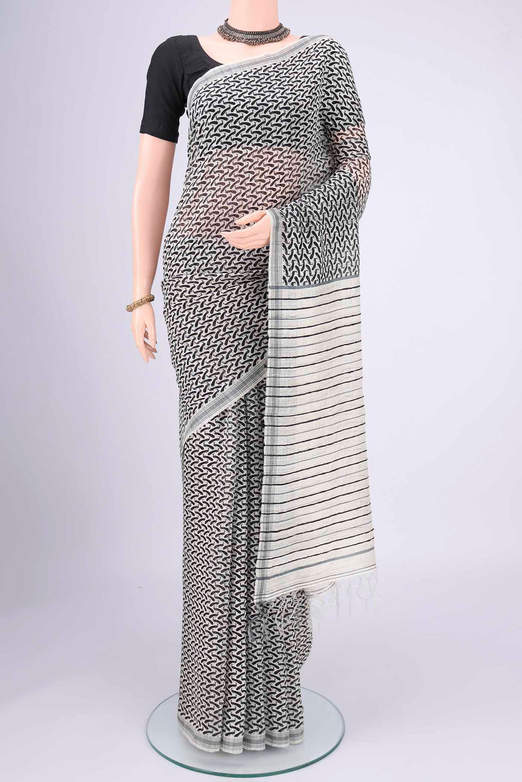 Off White Tussar Silk Saree with Bird Print on the body and Plain Border.  displayed on a mannequin