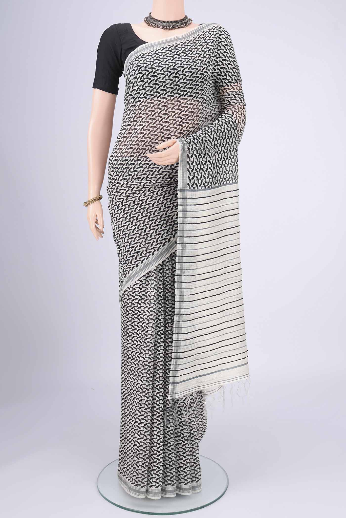 Off White Tussar Silk Saree with Bird Print on the body and Plain Border.  displayed on a mannequin