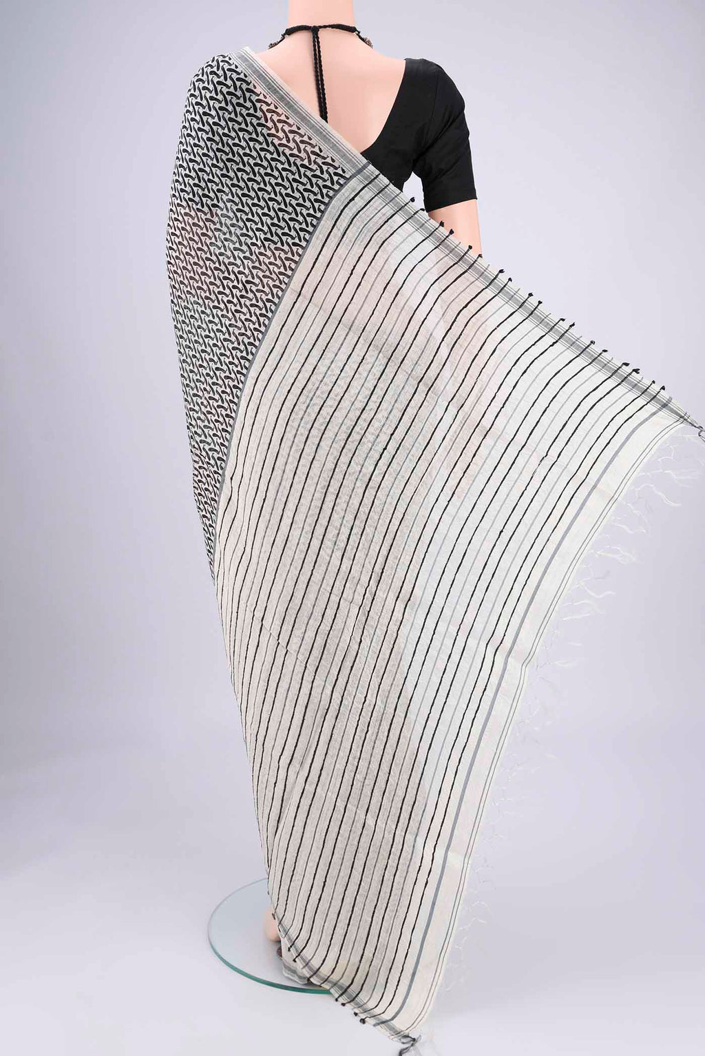 Flat view of Off White Tussar Silk Saree with Bird Print on the body and Plain Border. 