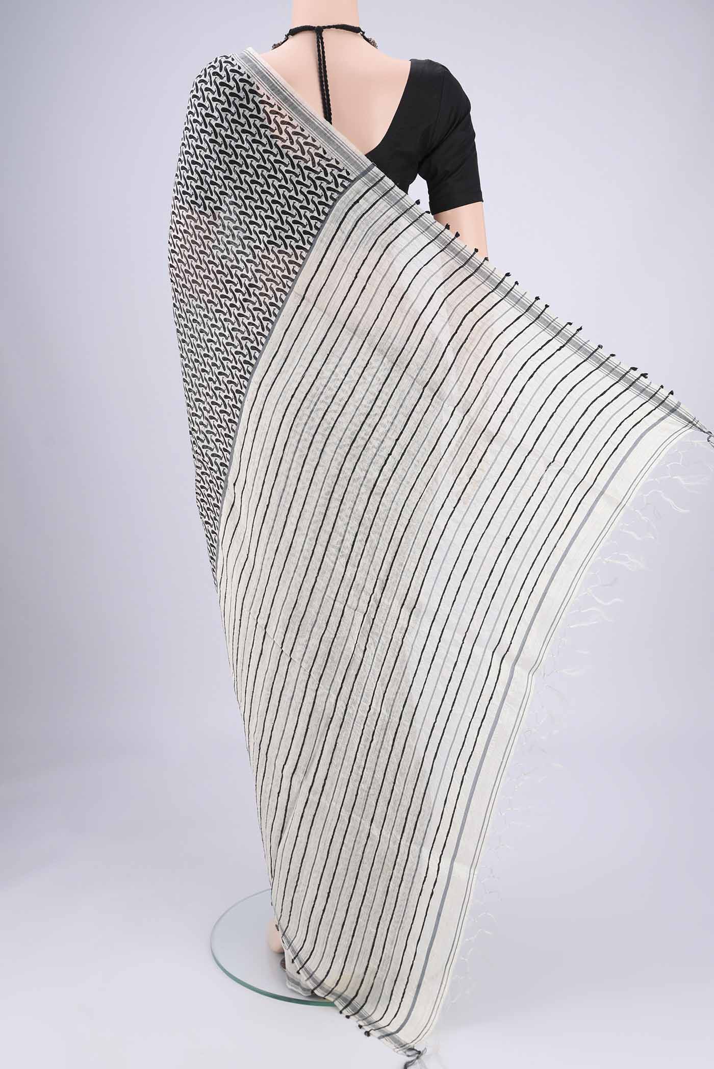 Flat view of Off White Tussar Silk Saree with Bird Print on the body and Plain Border. 