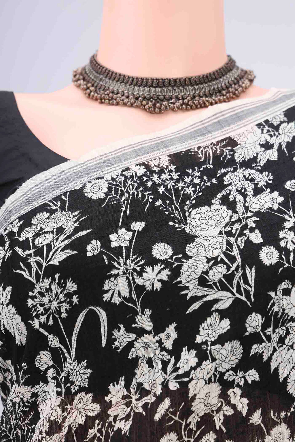 Border image of Black Tussar Silk Saree with Printed design on the body and Plain Border. 