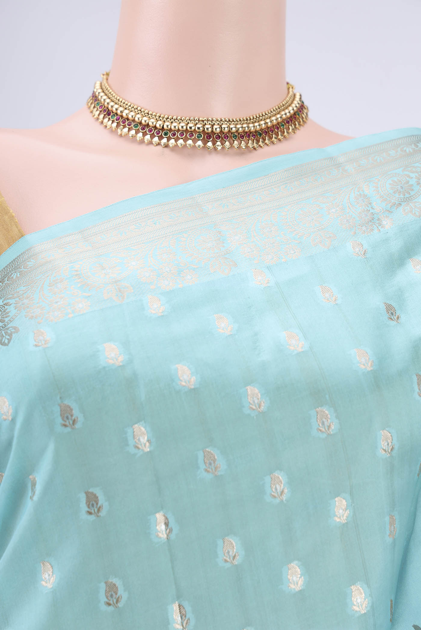 Border image of Turquoise Banarasi Raw Silk Saree with Zari Butta on the body and Zari Border. 