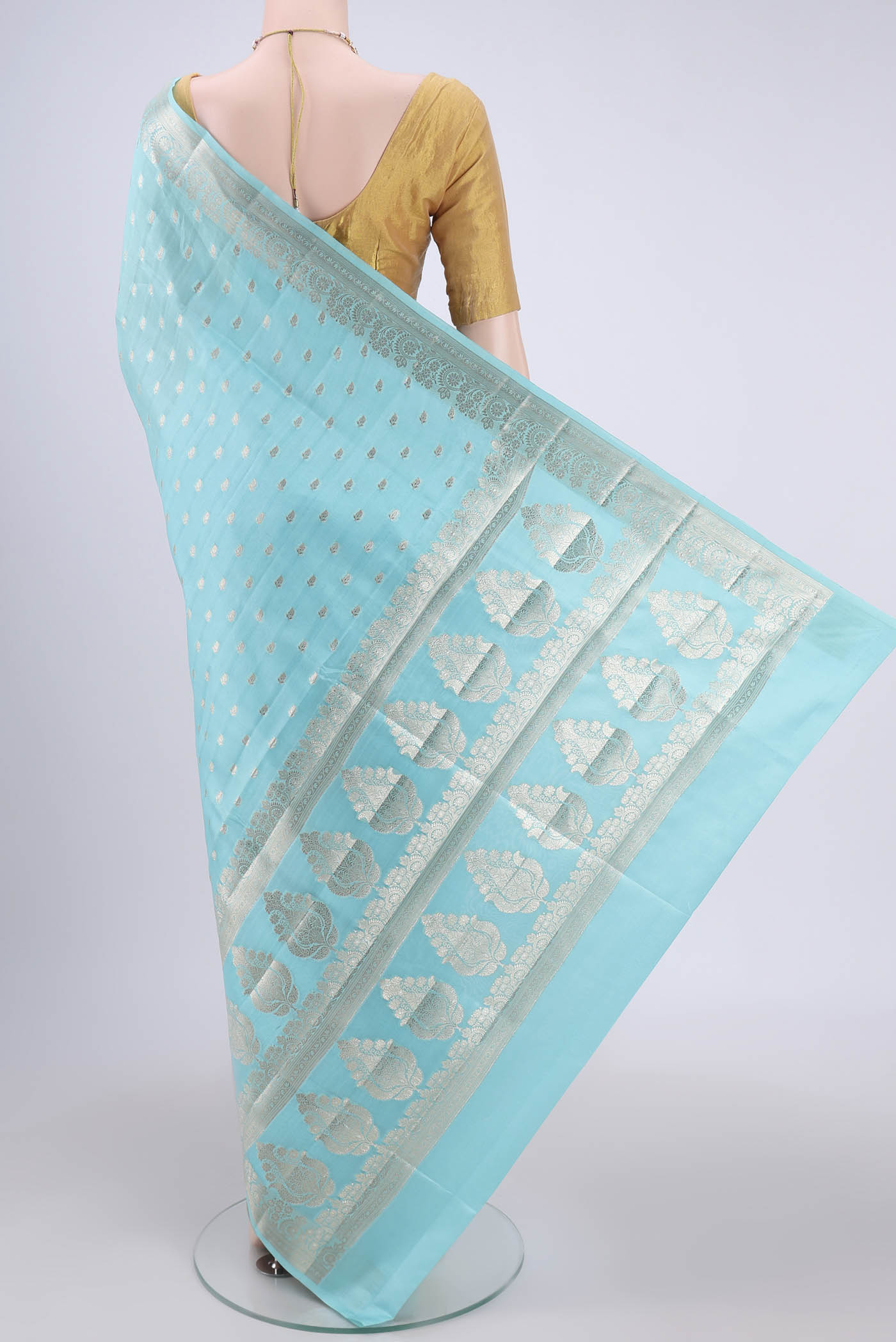 Flat view of Turquoise Banarasi Raw Silk Saree with Zari Butta on the body and Zari Border. 