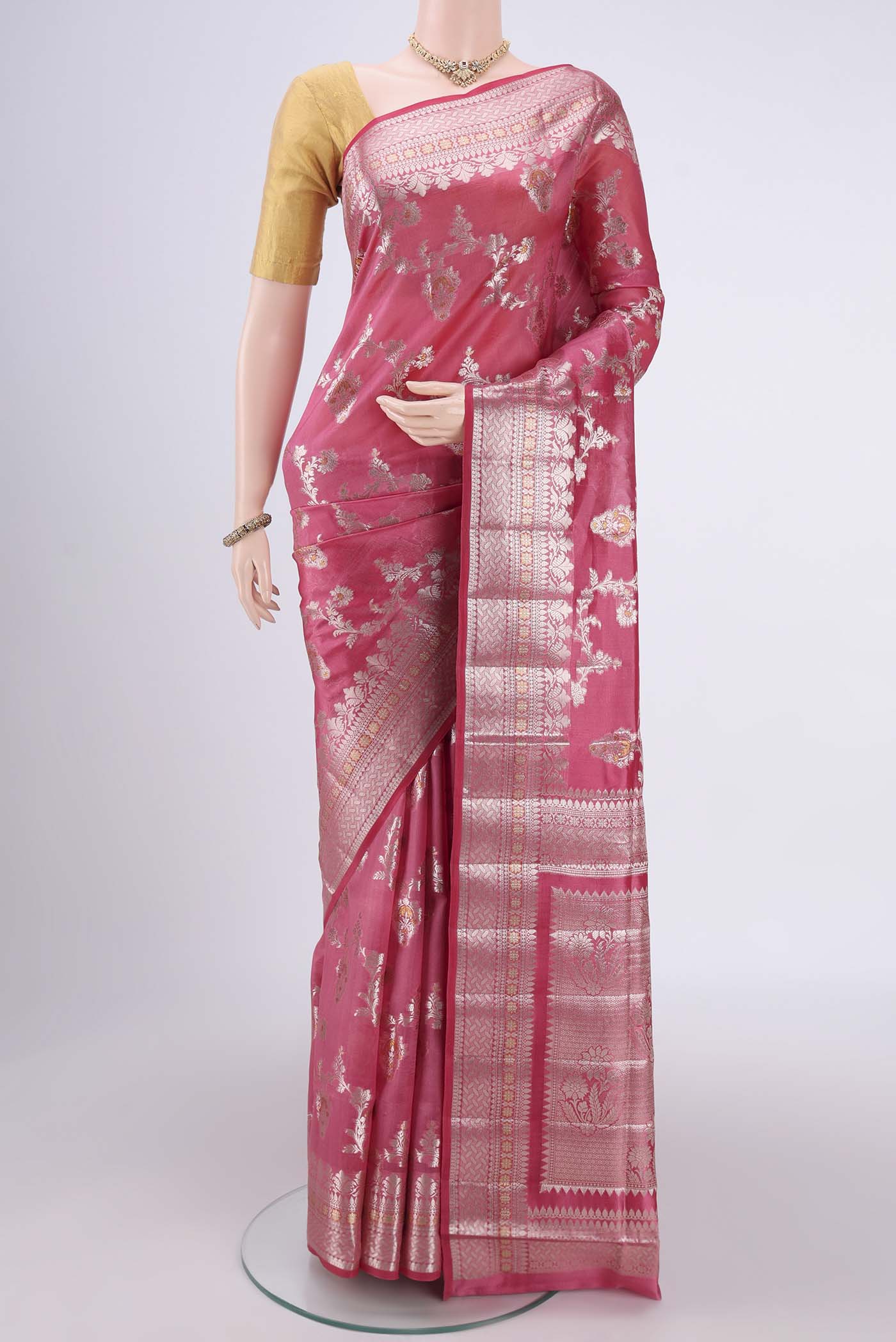 Pink Banarasi Raw Silk Saree with Zari Brocade on the body and Zari Border.  displayed on a mannequin