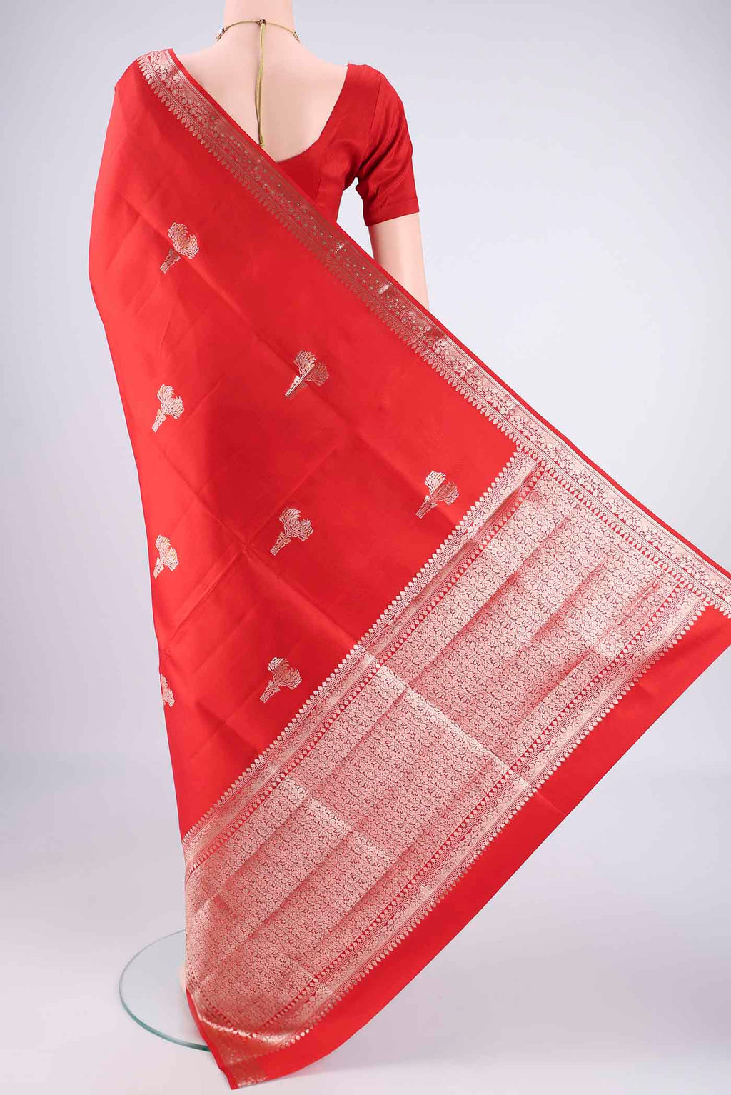 Flat view of Red Banarasi Raw Silk Saree with Zari Butta on the body and Zari Border. 