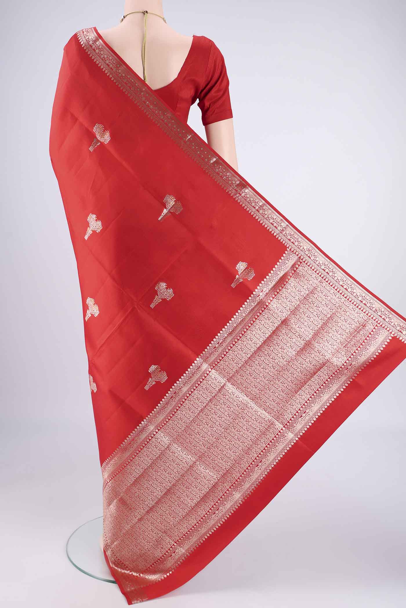 Flat view of Red Banarasi Raw Silk Saree with Zari Butta on the body and Zari Border. 