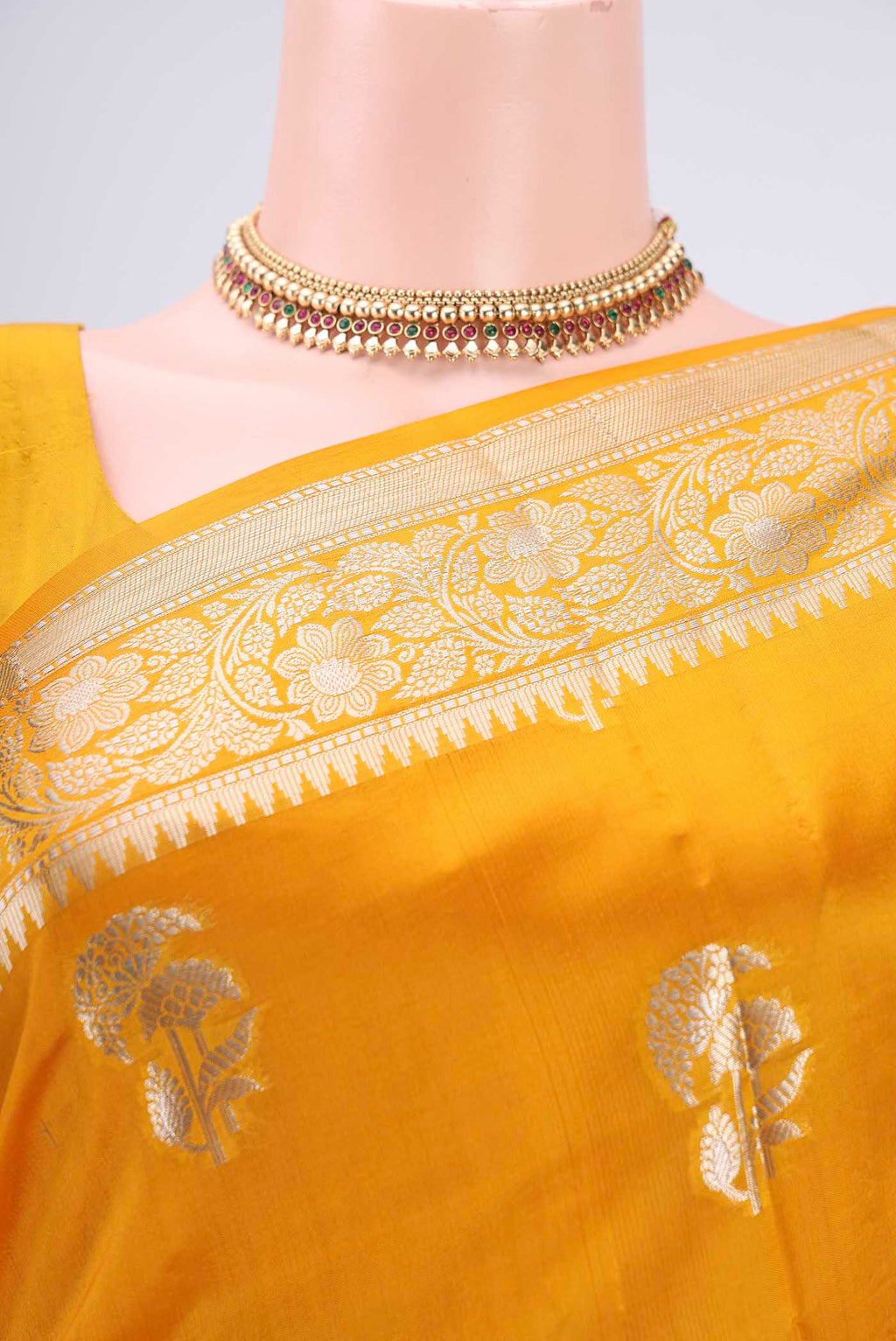 Border image of Yellow Banarasi Raw Silk Saree with Zari Butta on the body and Zari Border. 
