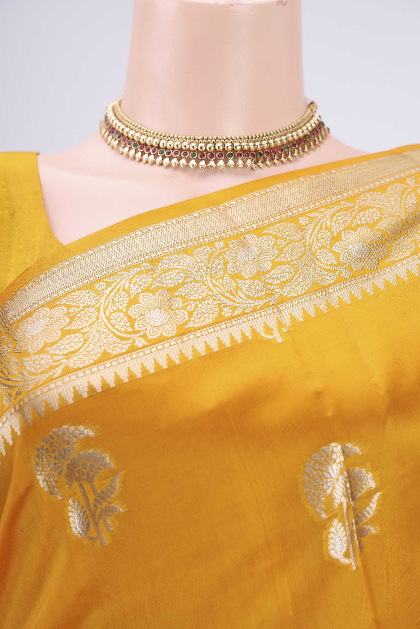 Border image of Yellow Banarasi Raw Silk Saree with Zari Butta on the body and Zari Border. 