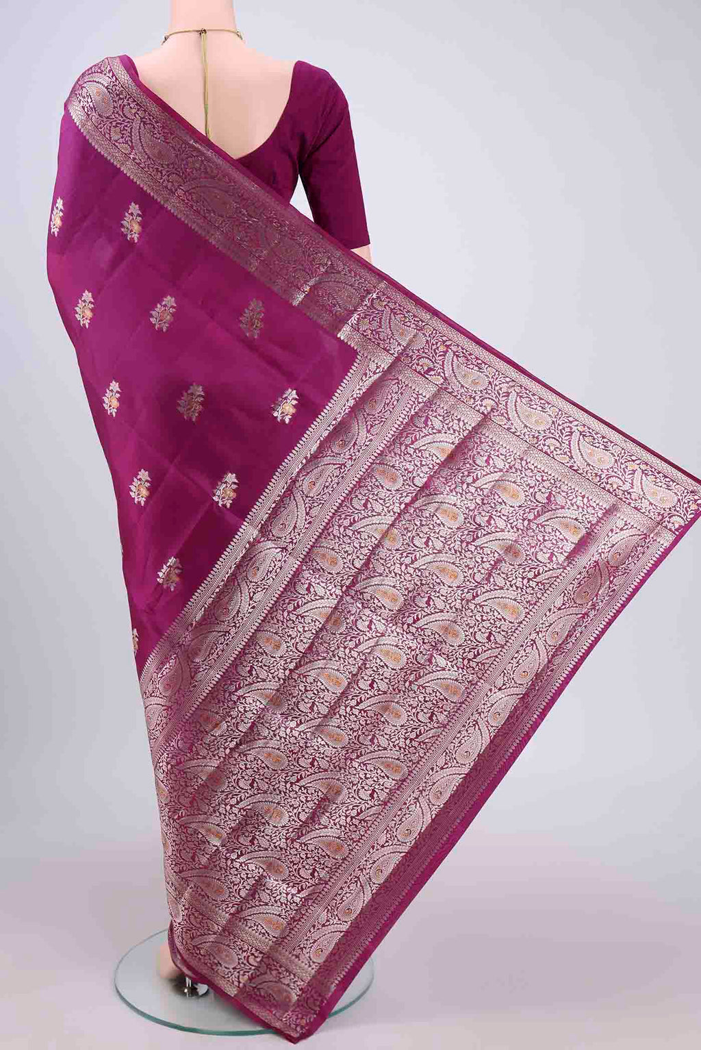 Flat view of Magenta Banarasi Raw Silk Saree with Zari Brocade on the body and Zari Border. 