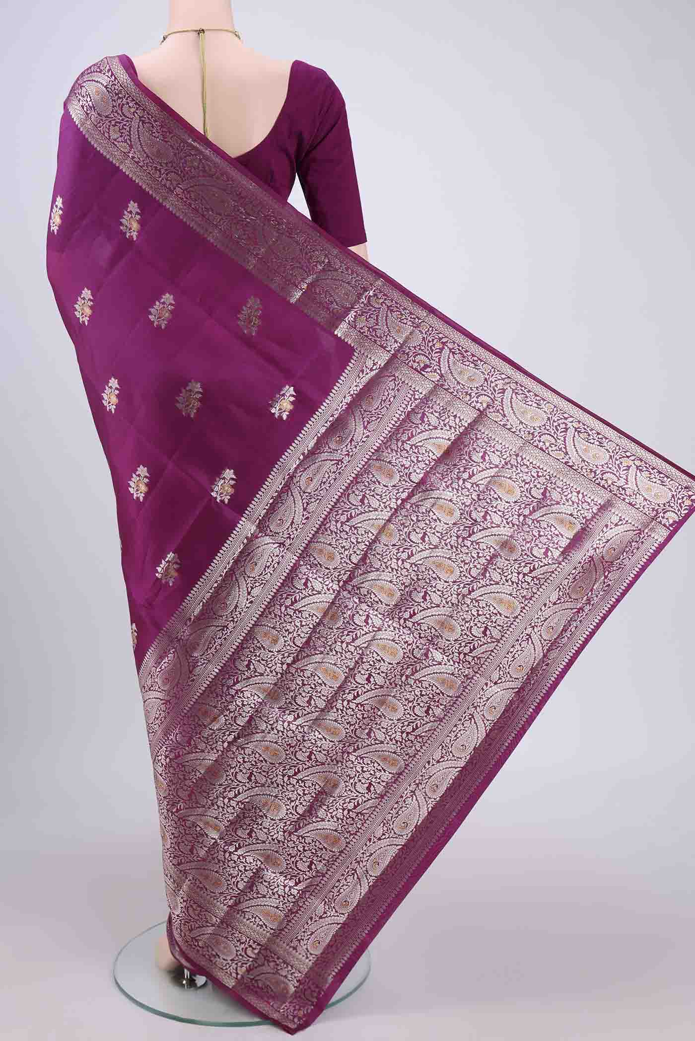 Flat view of Magenta Banarasi Raw Silk Saree with Zari Brocade on the body and Zari Border. 