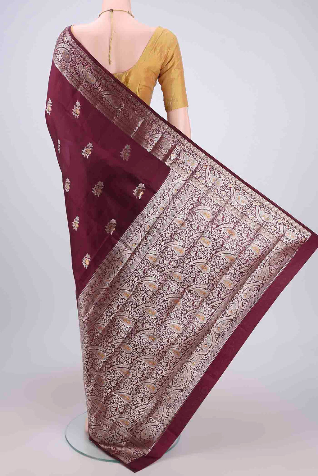 Flat view of Burgundy Banarasi Raw Silk Saree with Zari Brocade on the body and Zari Border. 