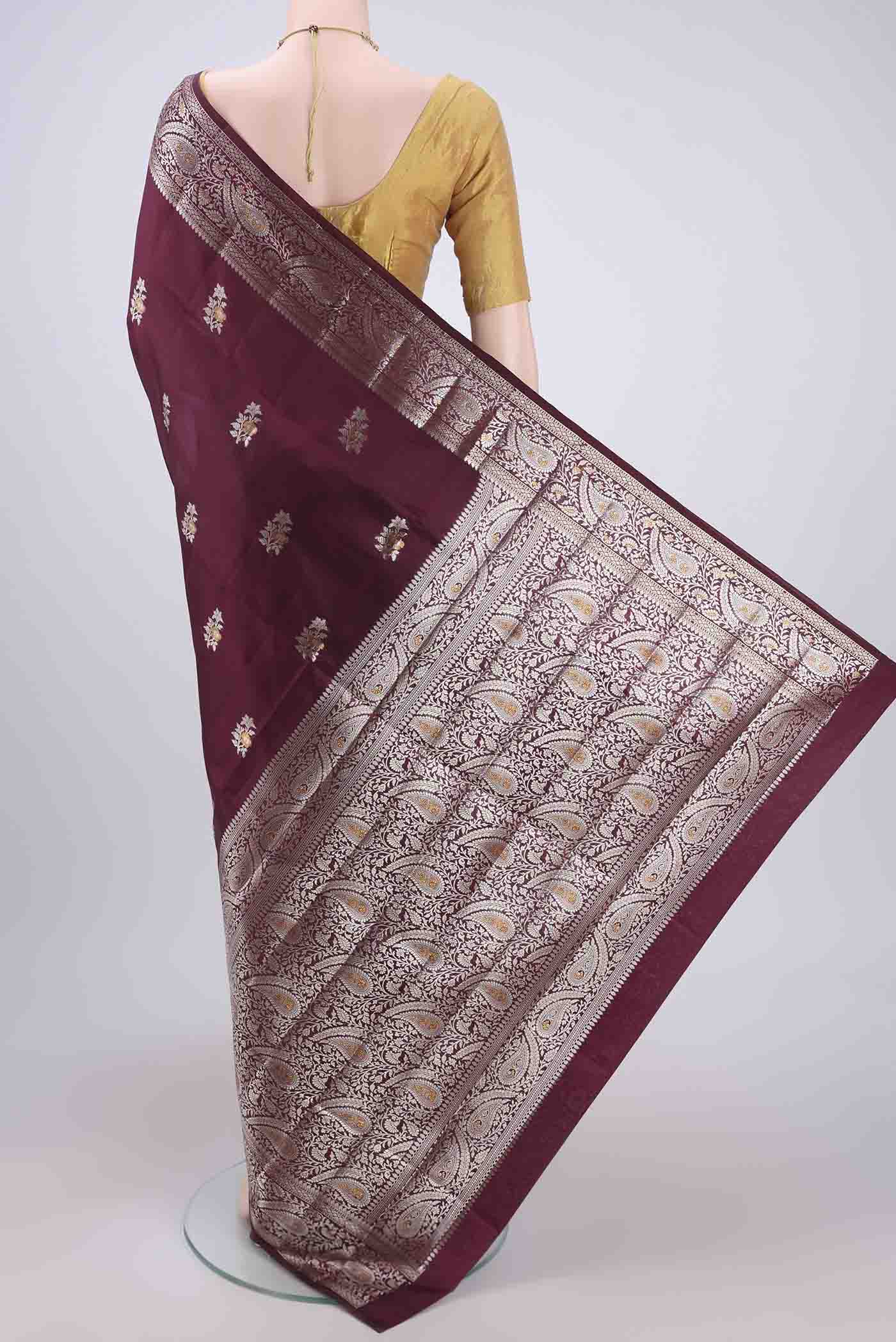 Flat view of Burgundy Banarasi Raw Silk Saree with Zari Brocade on the body and Zari Border. 
