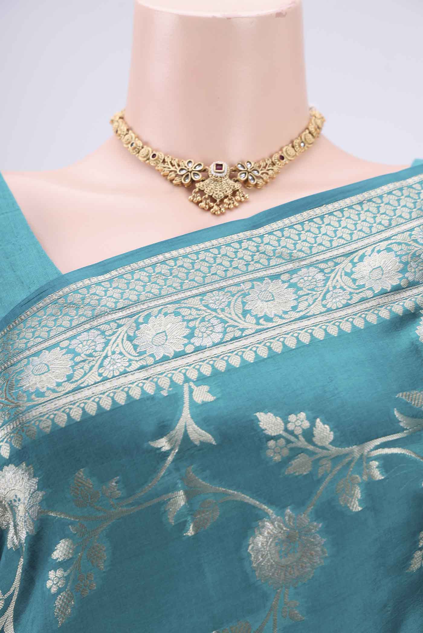 Border image of Peacock Blue Banarasi Raw Silk Saree with Zari Brocade on the body and Zari Border. 