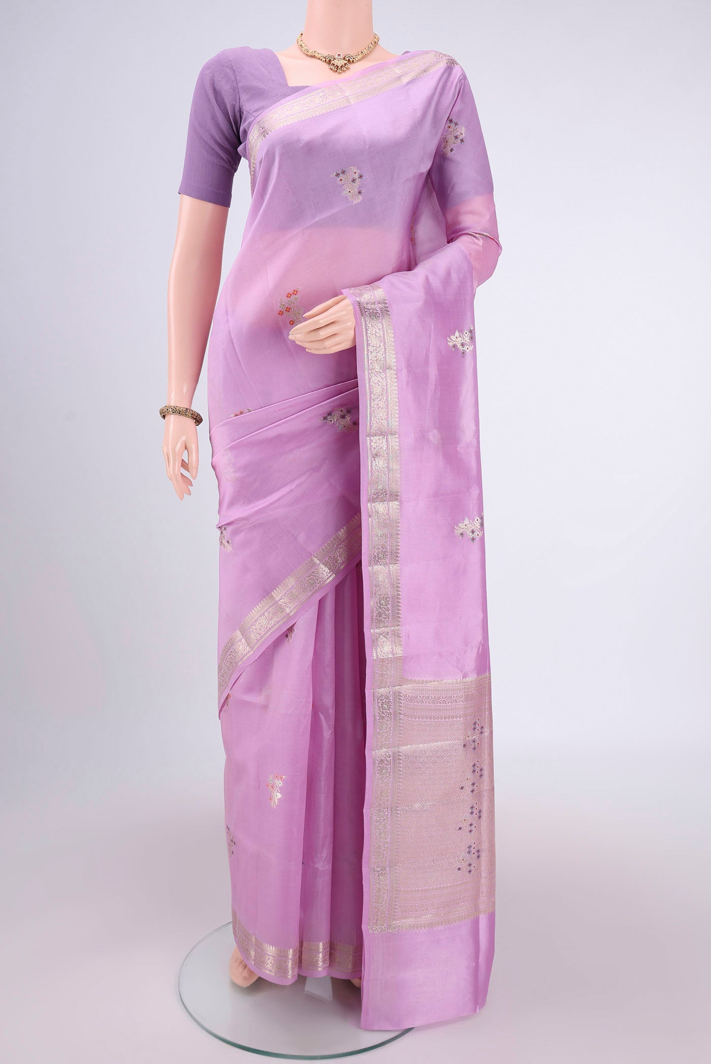 Pink Banarasi Raw Silk Saree with Zari Butta on the body and Zari Border.  displayed on a mannequin