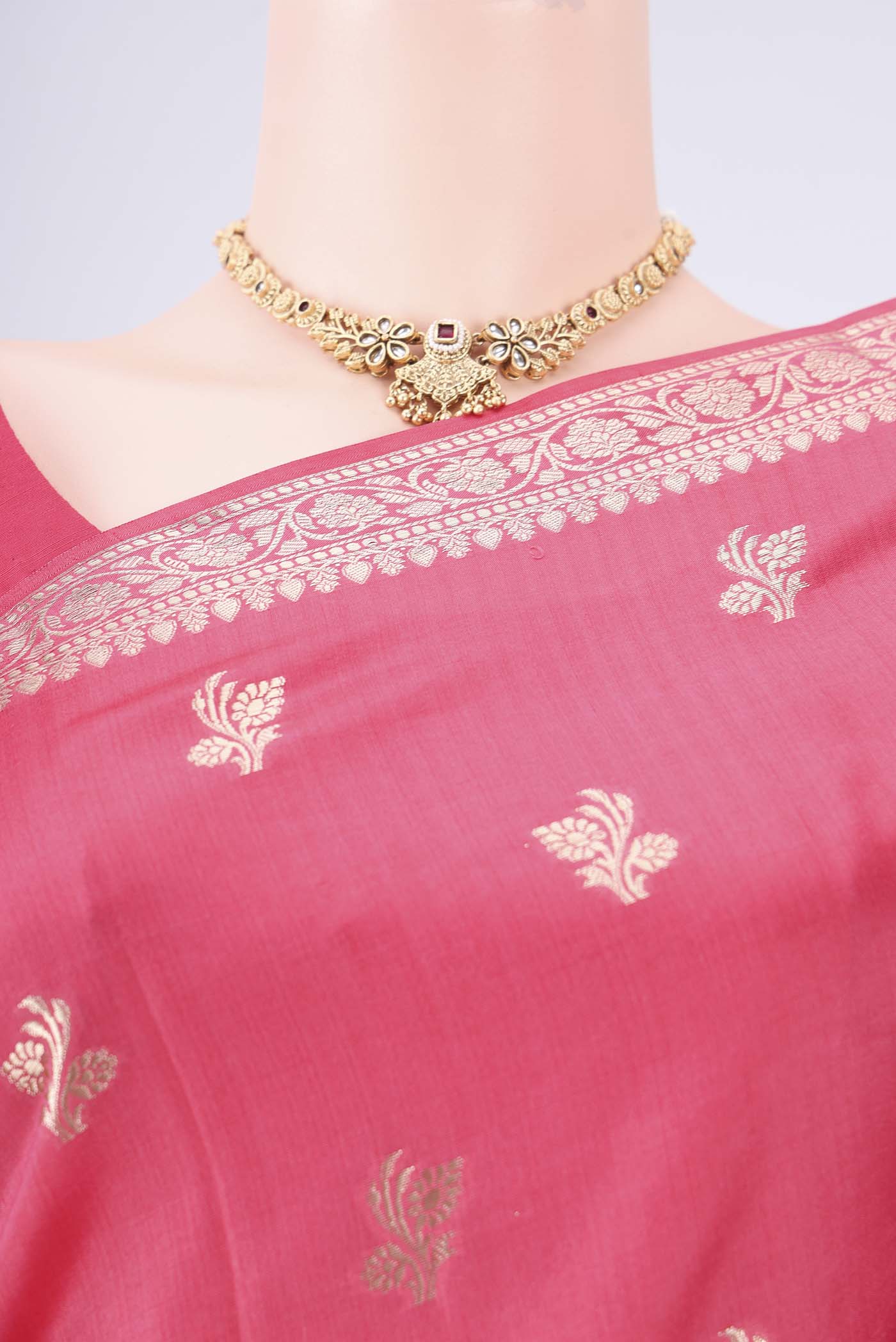 Border image of Peach Banarasi Raw Silk Saree with Zari Butta on the body and Zari Border. 